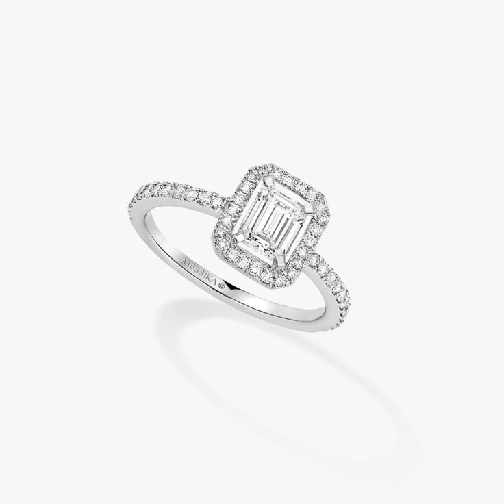 Emerald cut diamond halo ring